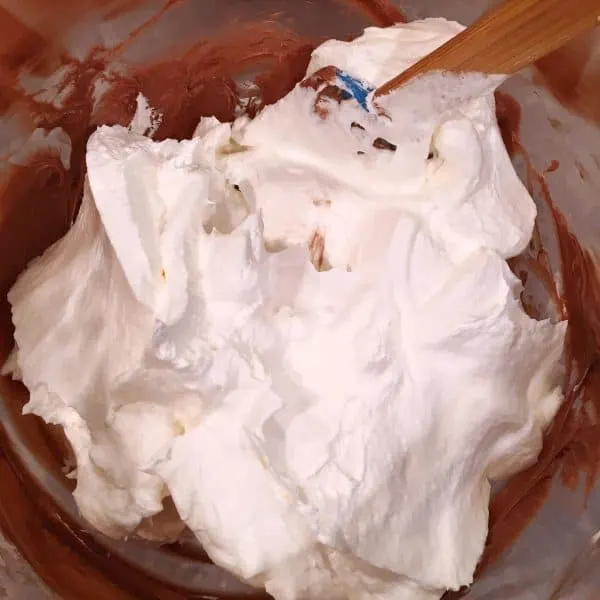 Addition of cool whip to cream cheese mixture