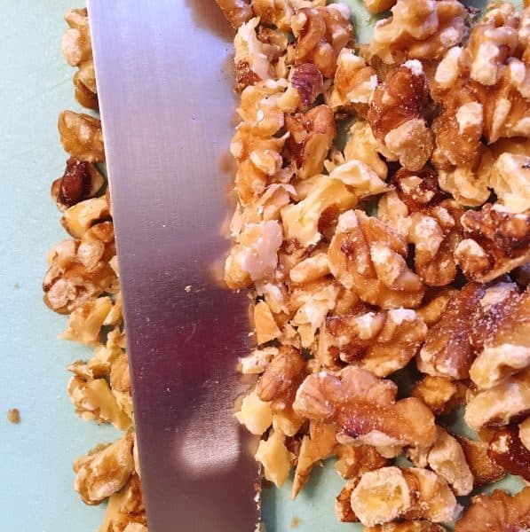 Chopped walnut with knife