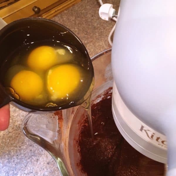 Adding Eggs to brownie batter