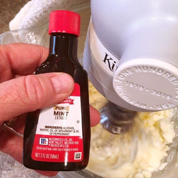 Mint extract being added to frosting