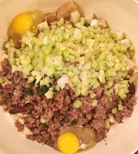 adding eggs and seasonings to stuffing