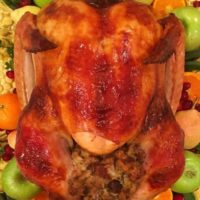 Turkey on a platter with stuffing and garnish