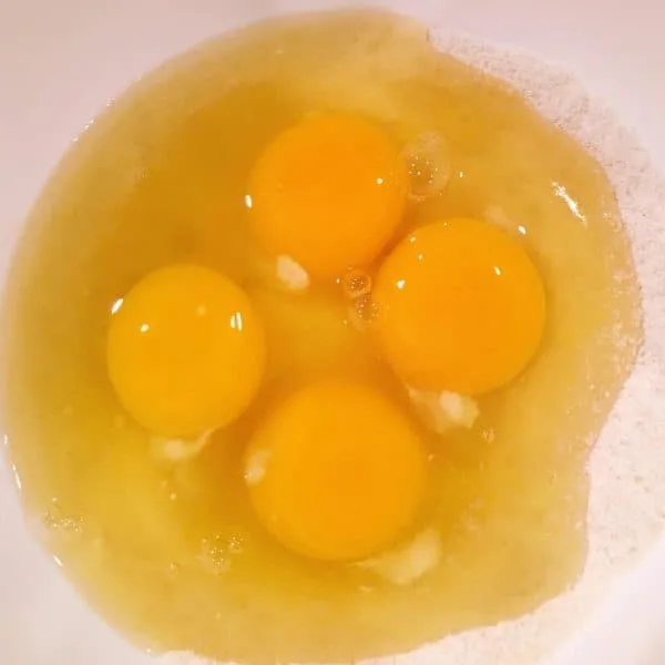 Eggs added to sugar and flour