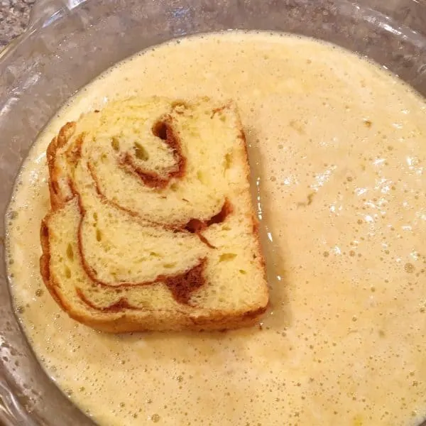 Dipping Bread in Batter