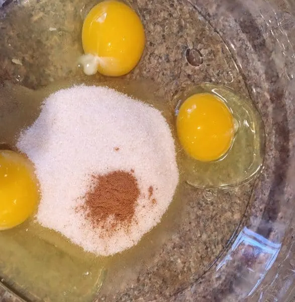 Add sugar and cinnamon to eggs