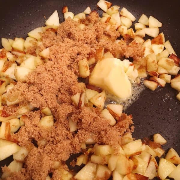 Adding butter and brown sugar to apples