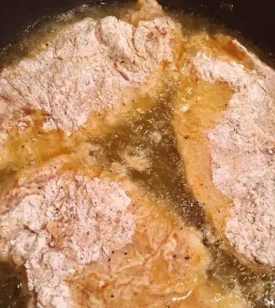 Chicken frying in oil