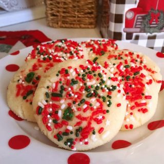 Christmas Sugar Sprinkle Cookies on a polka dot plate.
