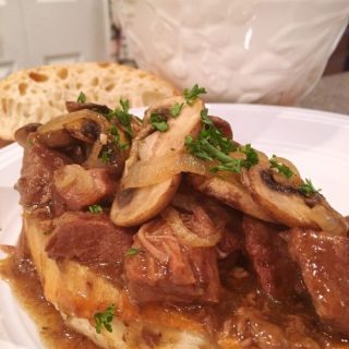 Open Face Slow Cooker Beef Sandwiches with mushroom gravy.