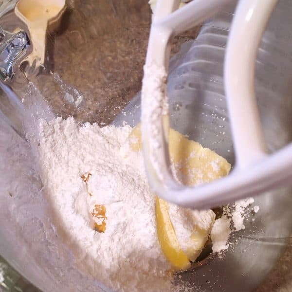 Mixer with powder sugar, butter, and vanilla