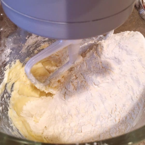 Adding flour to dough mixture