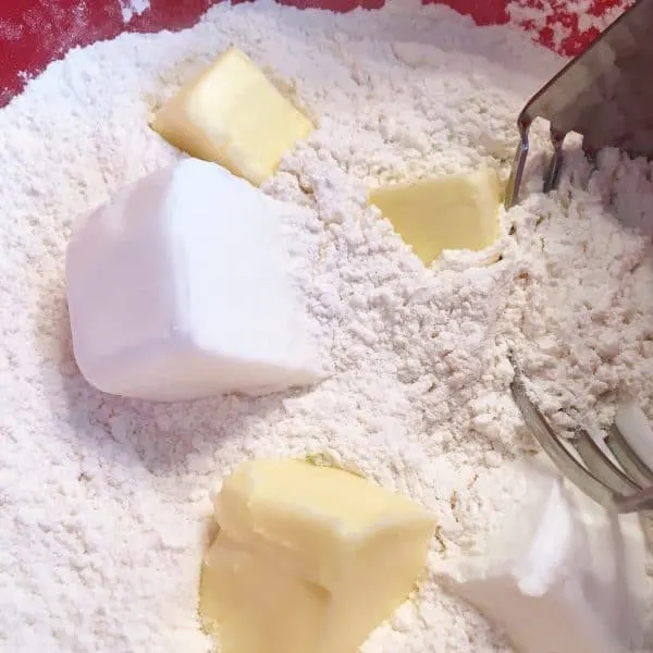 Adding shortening and butter to biscuits