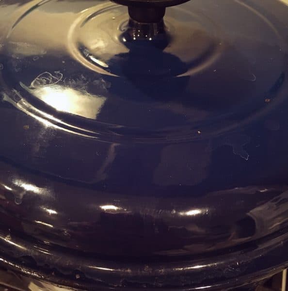 Lid covering pot while dumplings cook