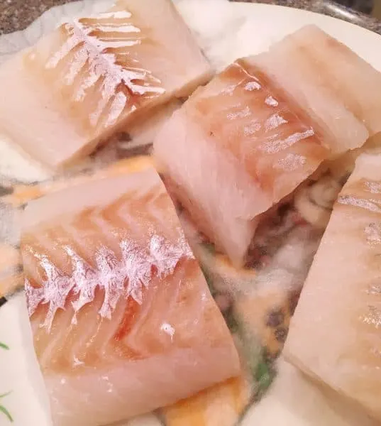 Cod cut into smaller pieces.