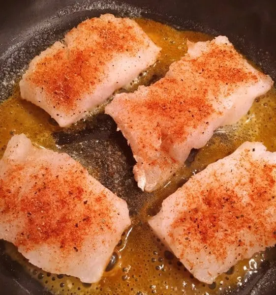 Seasoned Cod in hot buttered skillet