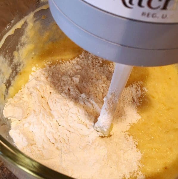 Mixing flour into cake batter