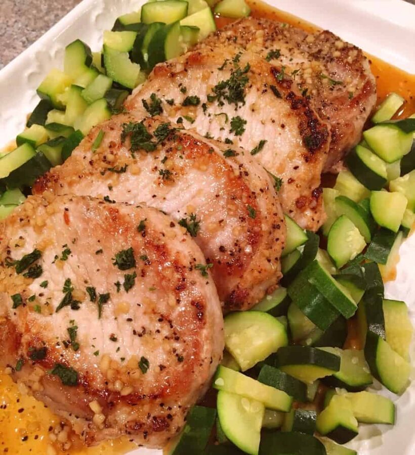 Serving platter fun of skillet honey garlic pork chops