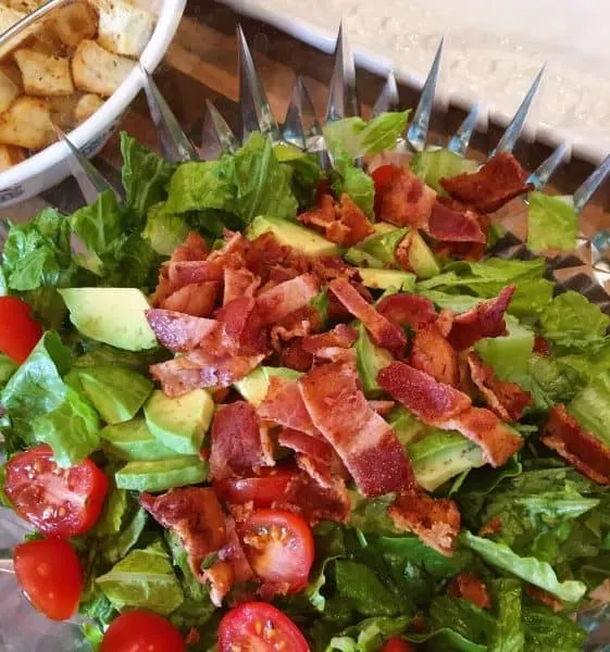 Lettuce, tomato, and bacon in salad bowl