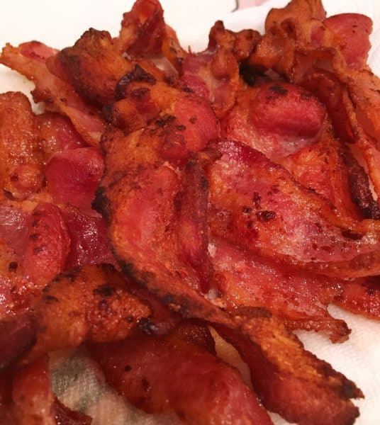 Bacon draining on paper towel