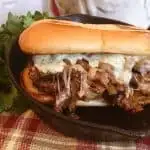 Pepper Jack Steak Sandwiches in a cast iron griddle.