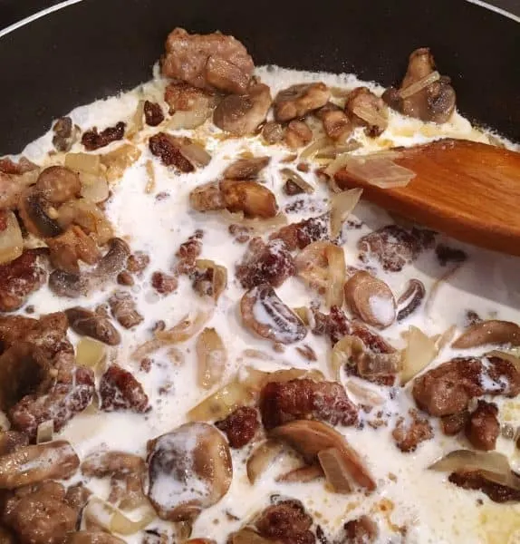 Heavy cream added into the skillet