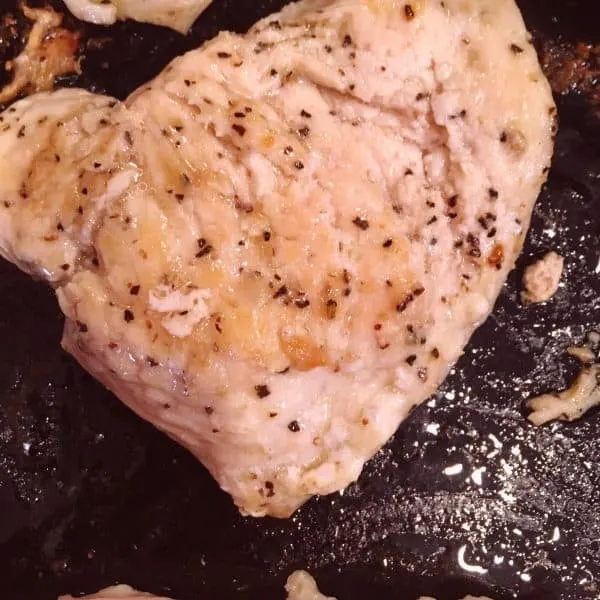 Chicken Breast cooking in skillet