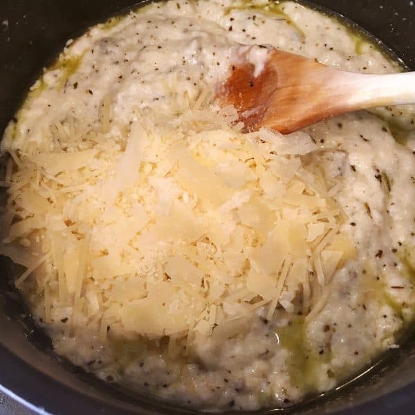 Adding parmesan cheese to sauce