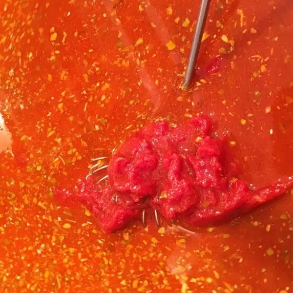 Tomato paste added to sauce