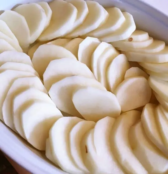 Sliced Potatoes in baking dish