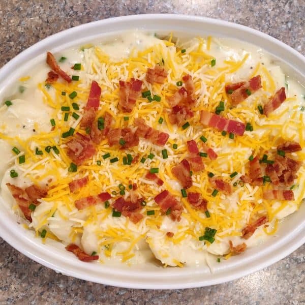 baking dish full of loaded scalloped potatoes