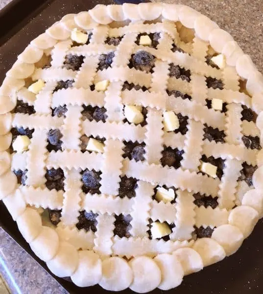 Fresh lattice work pie going in the oven