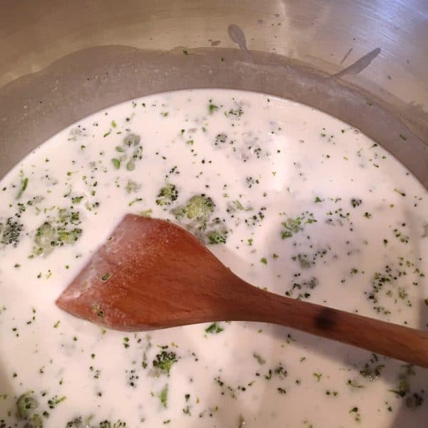 Stirring cream of broccoli soup