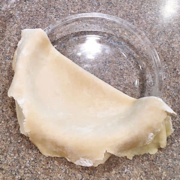 Placing pie crust in pie plate