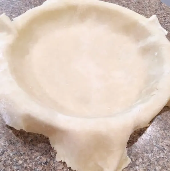 Placing Pie crust in pie plate