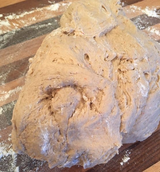 Carrot Cake Mix dough on flour cutting board ready to lightly knead.