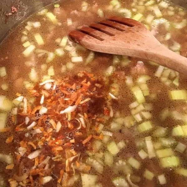Adding Lipton Soup mix to soup in pot