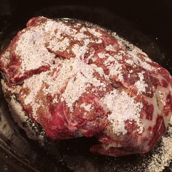 Roast Beef Chunks in slow cooker with brown gravy mix and ranch dressing.