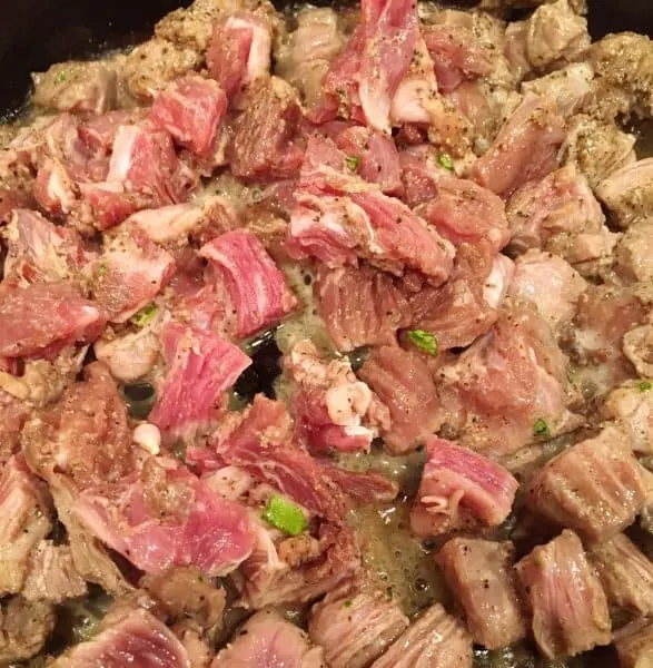 Seasoned Beef Fajita seasoned skirt steak sizzling in pan