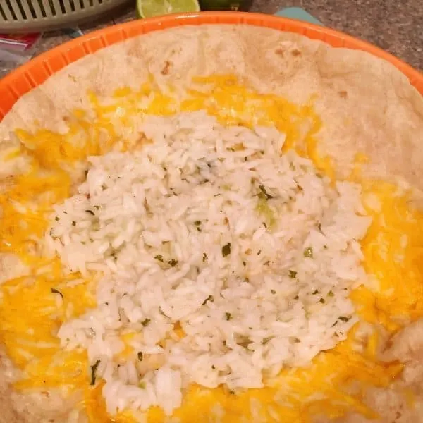 Layer of Cilantro Lime Rice added to
