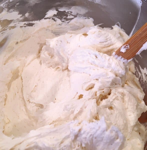 Mixing bowl full of vanilla bean buttercream frosting