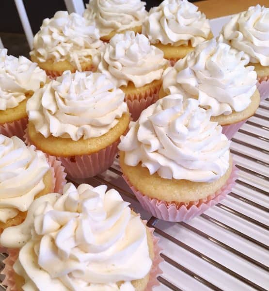Baked and frosted Vanilla Cupcakes