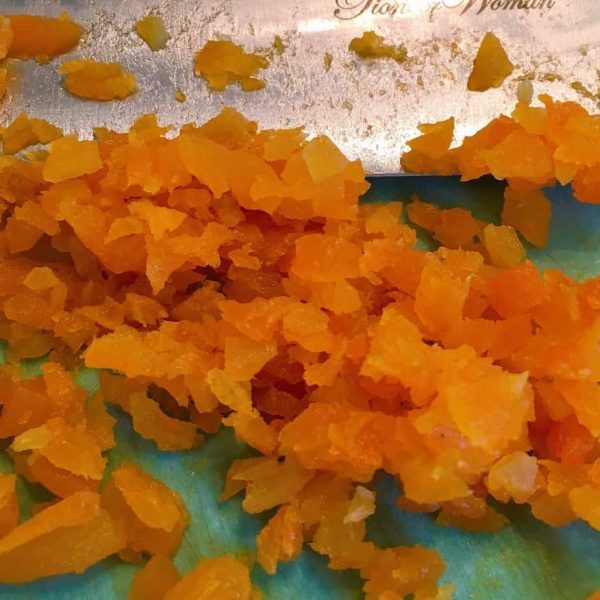 Chopped dried apricots on cutting board