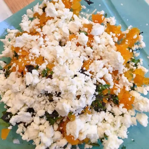 Adding Feta cheese to bruschetta