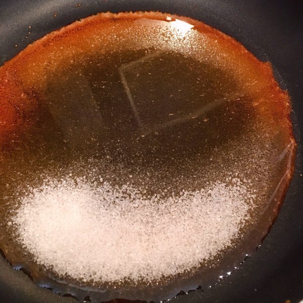 Melting the sugar in the skillet.