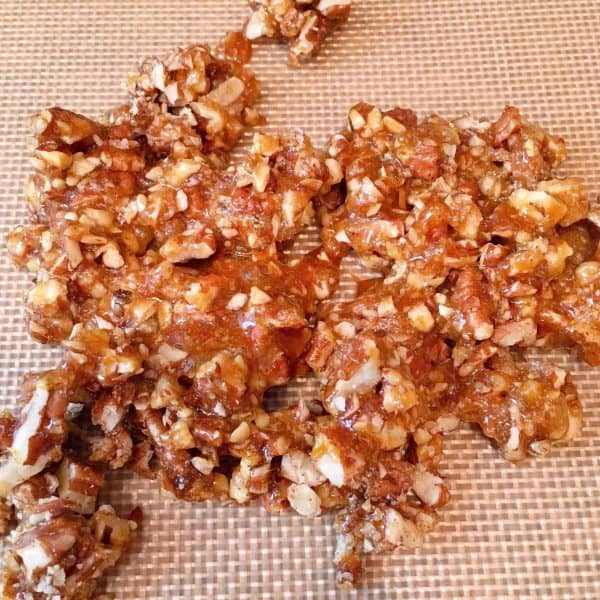 Candied Pecans on silicone mat cooling