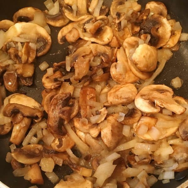 Mushrooms and onions cooked for patty melts