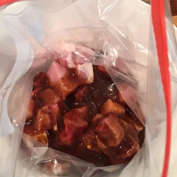 Steak and Pork in a plastic bag with Marinade