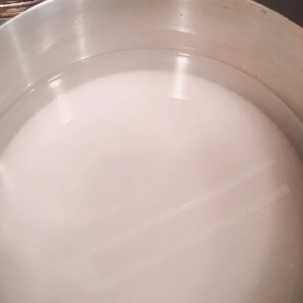 Sugar and water in sauce pan over medium heat..