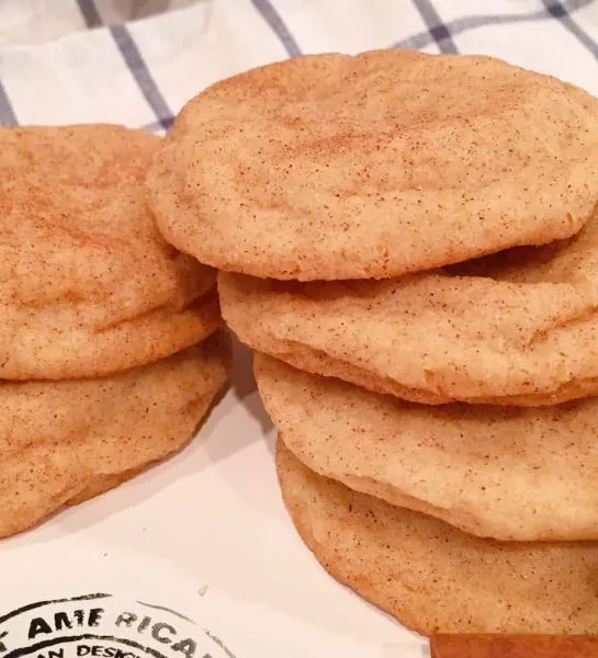 Pile of Scrumptious Classic Chewy Snickerdoodles with cinnamon sticks