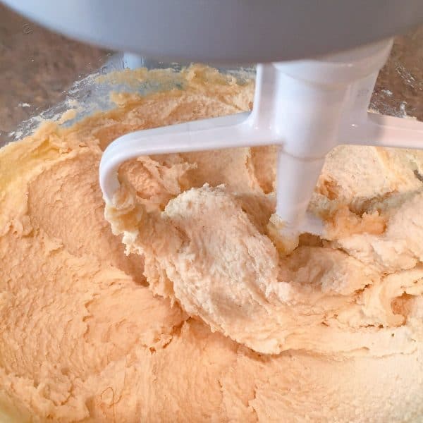 creaming together butter, sugar, and brown sugar for snickerdoodle cookies